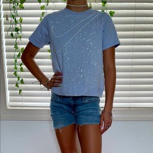 Blue Nike t-shirt that is a size small.